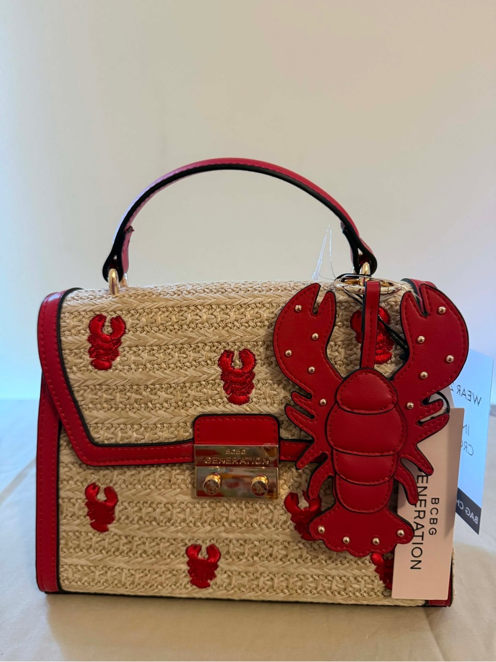 BCBGeneration Straw Satchel with Red Trim & Lobster Charm